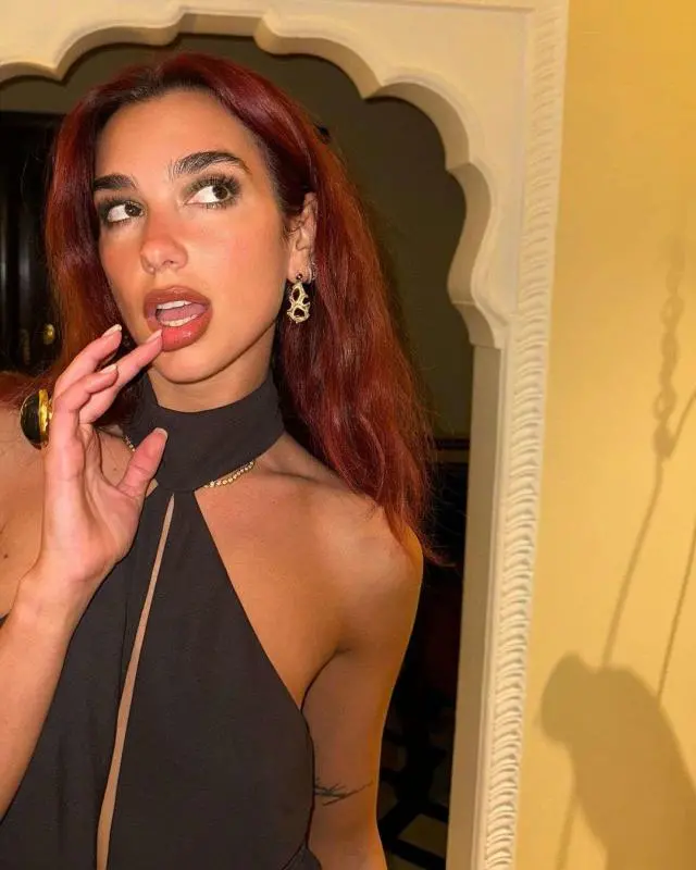 Dua Lipa stunning in a color trend as versatile as black! Elevate your style with this underrated shade that’s making a statement. –