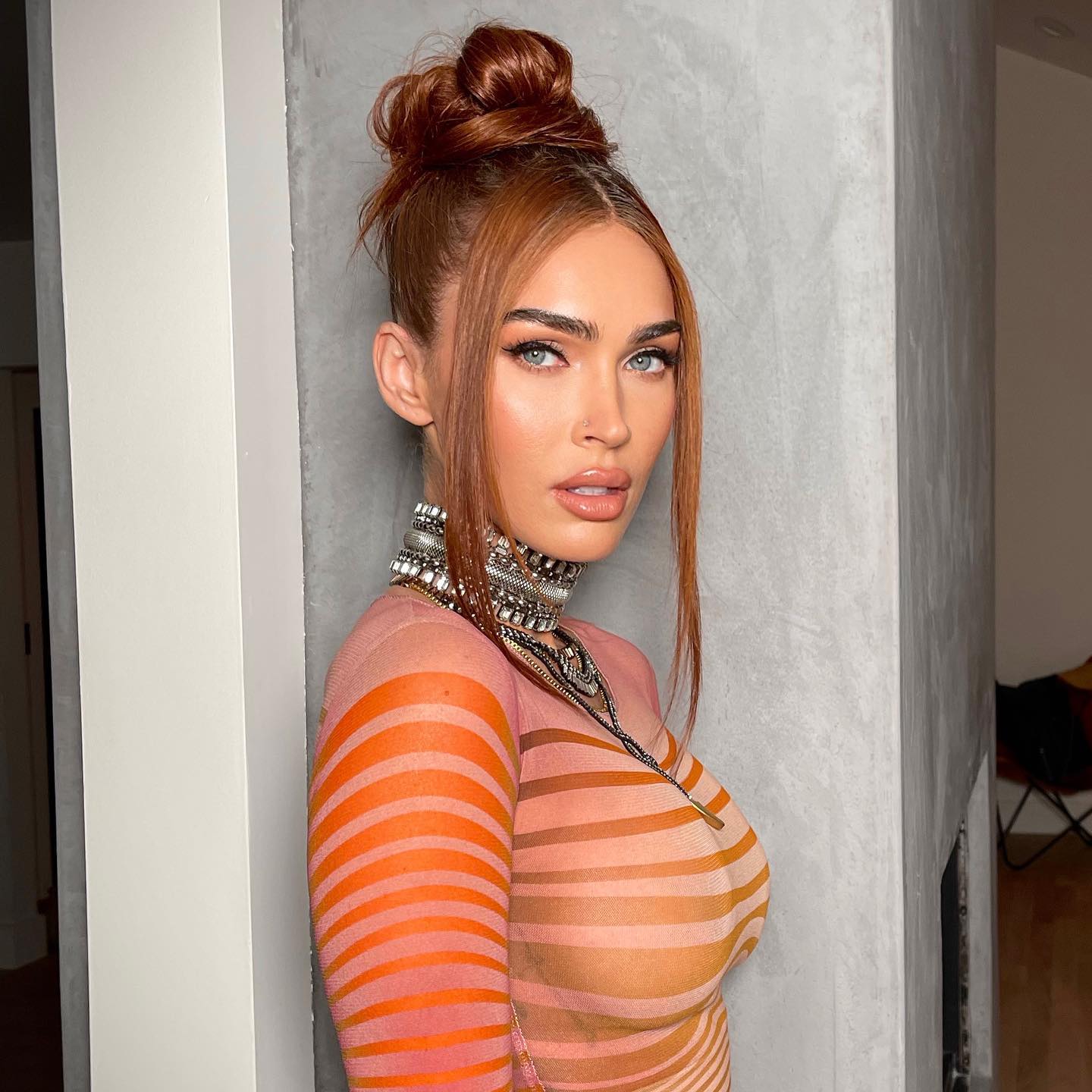 Megan Fox stuns in a daringly sheer orange dress