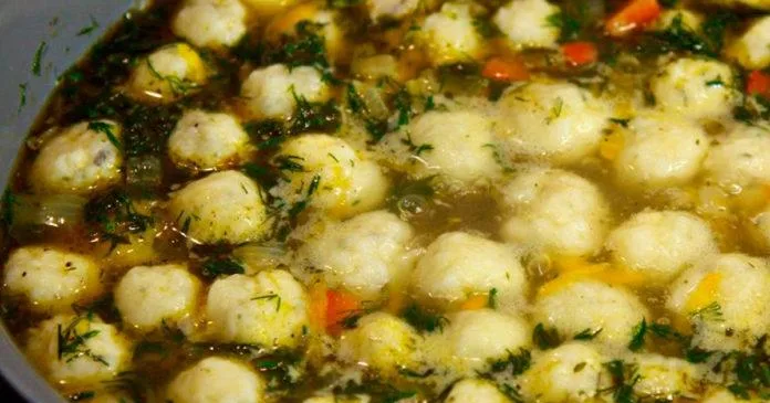 Wonderful chicken soup topped with cheese balls: a delicious surprise…