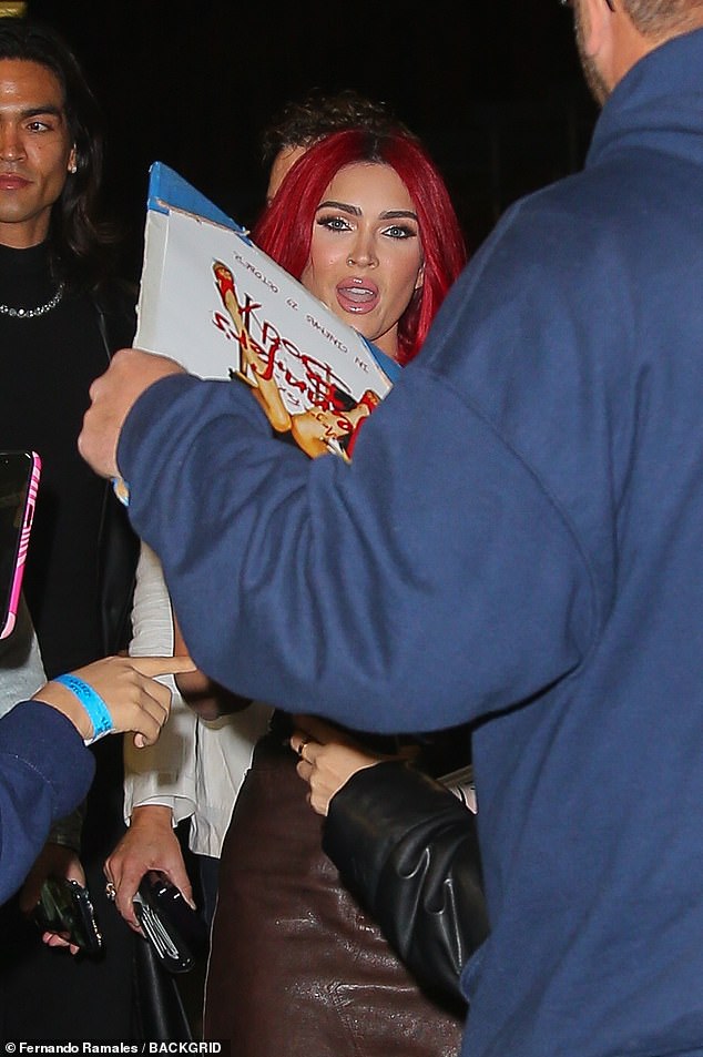 Megan Fox with her bestselling poetry book