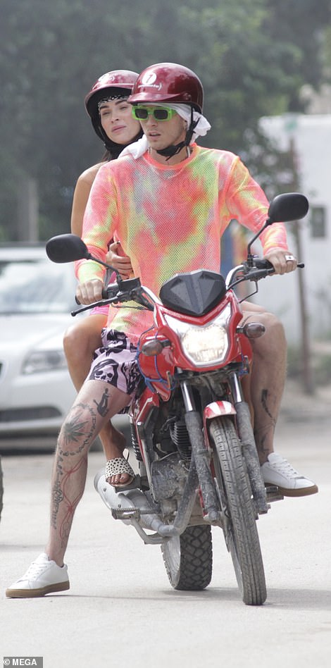 Safety first: The Transformers actress did keep her head protected, however, as she sported a shiny red helmet