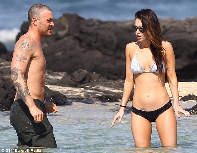 Testing the waters: Green tries to get his wife to take a dip in the ocean