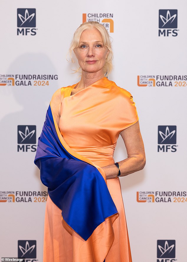 Joely Richardson in a glamorous silk wrap dress at the Children with Cancer Fundraising Gala in London.