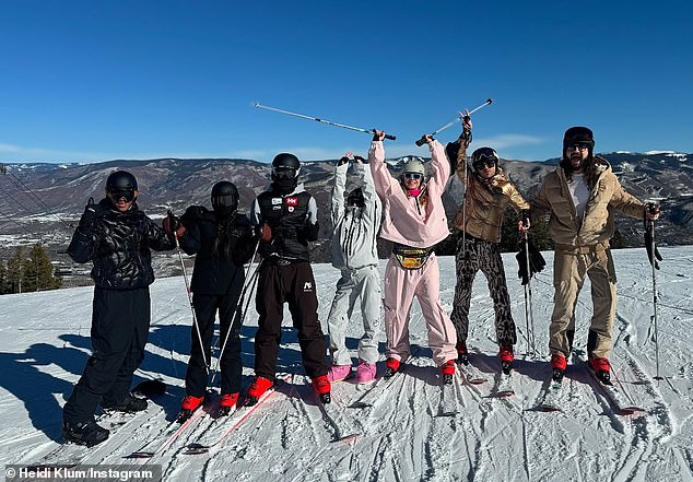 Heidi Klum in the same John Snow snowsuit during a family snap on the summit